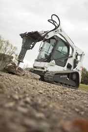 Bobcat equipment with hydraulic breaker attachment outside