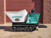 side view of a whiteman cement buggy in front of garage door