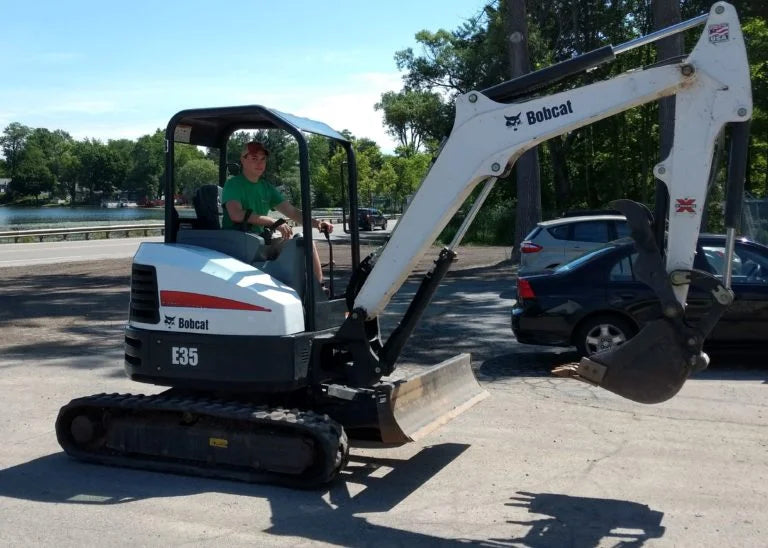 side view of a Bobcat excavator in a parking lot