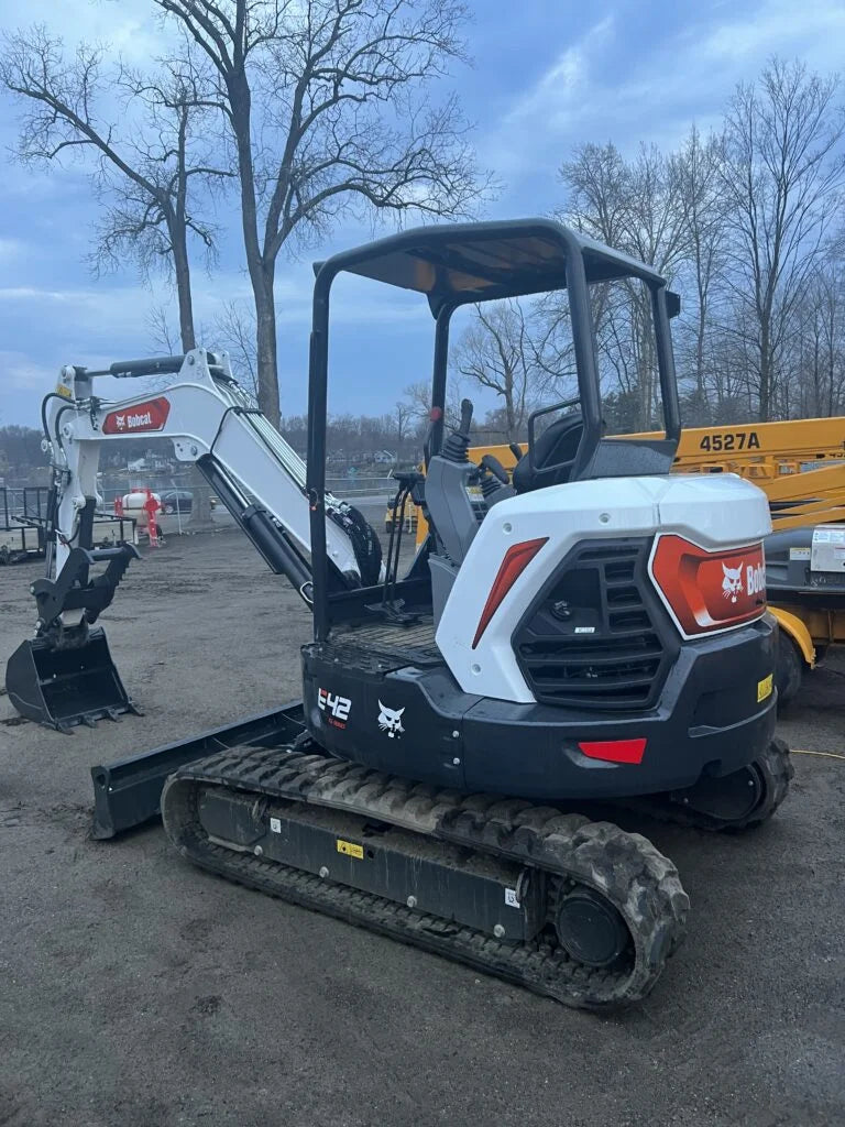 Side of bobcat mini excavator in Ward's Rental yard