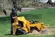 man usign stump grinder outside