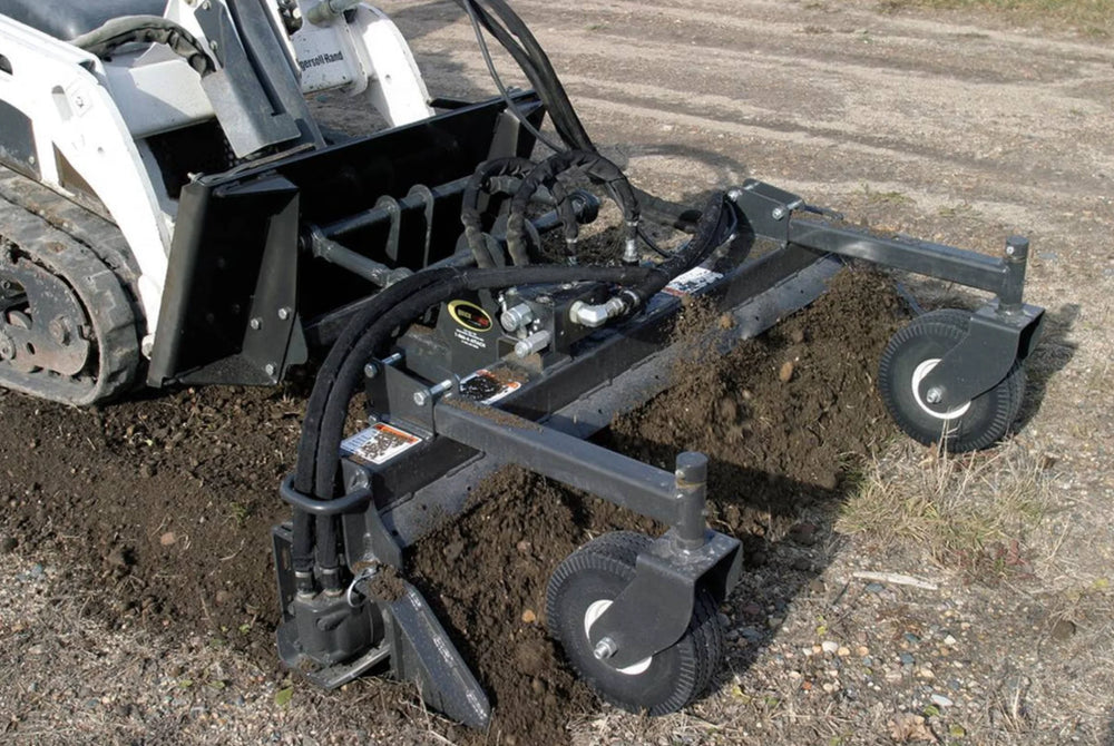 close up of soil conditioner attached to a bobcat skid loader